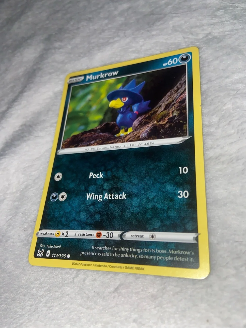 Murkrow Pokémon card (#114/196)